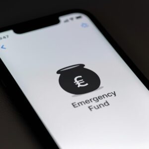Smartphone banking app showing a savings pot called ‘Emergency Fund’ representing Building an Emergency Fund