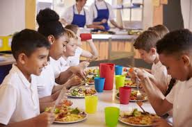 Children eating breakfast at a UK school breakfast club