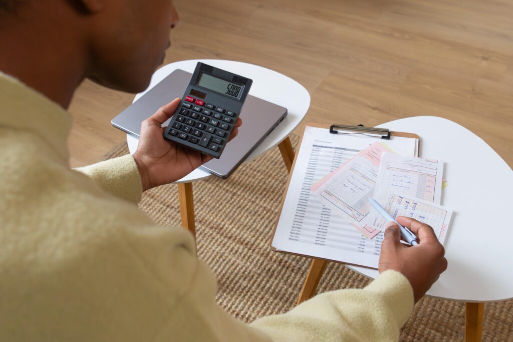 Reviewing household bills and essential living costs while budgeting